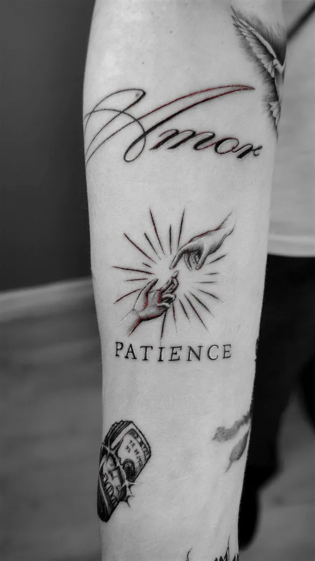 Amor, patience, a forearm tattoo by Karan Sandhar